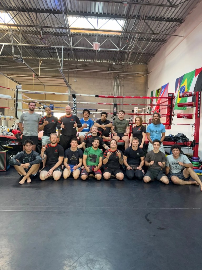 Three Pillars grappling class gathered at the ring